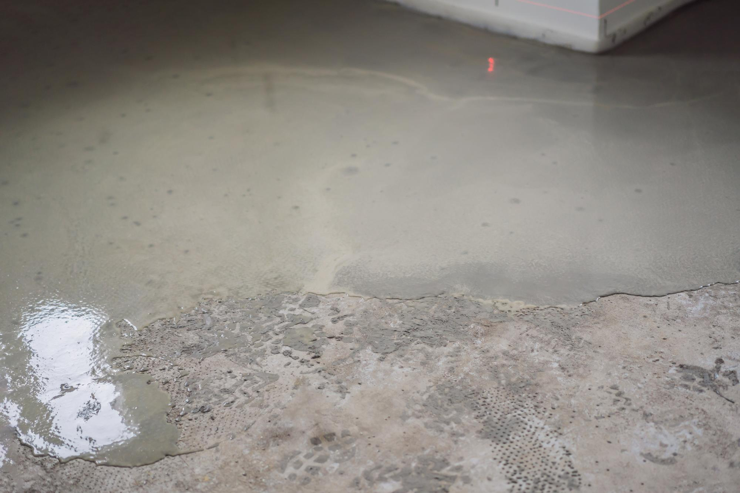 Water seeping through a cracked basement floor — foundation leak requiring professional waterproofing repair in Toronto